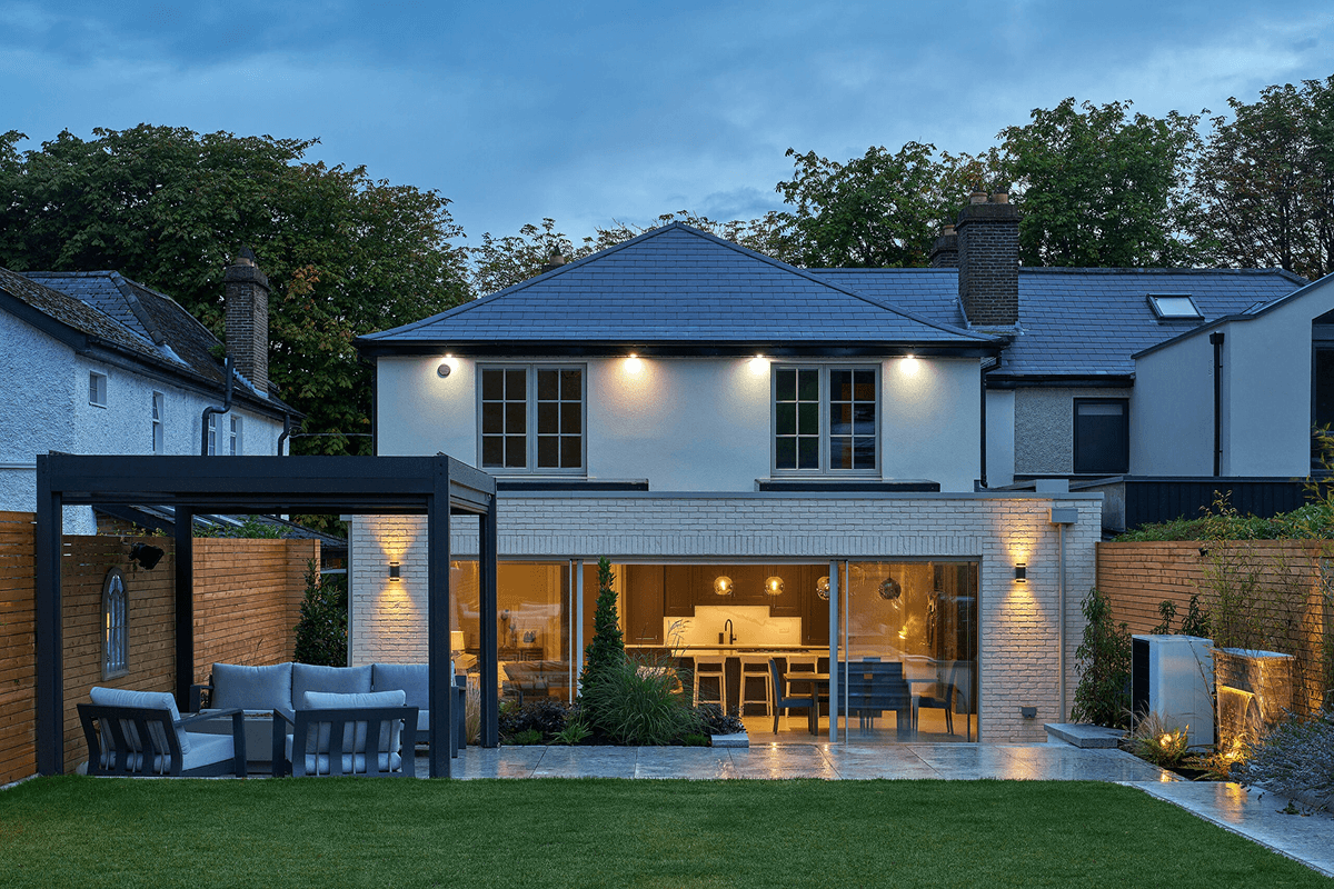 A premium Shomera house extension lit at dusk